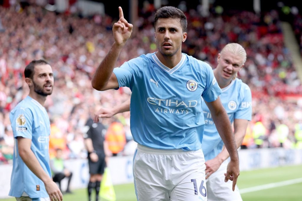 City beat Sheffield United 2-1 to go top with their third win in a row